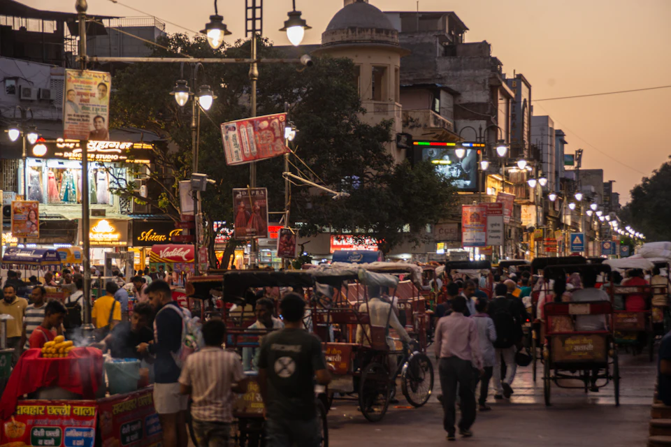 Busy street market with shops at dusk