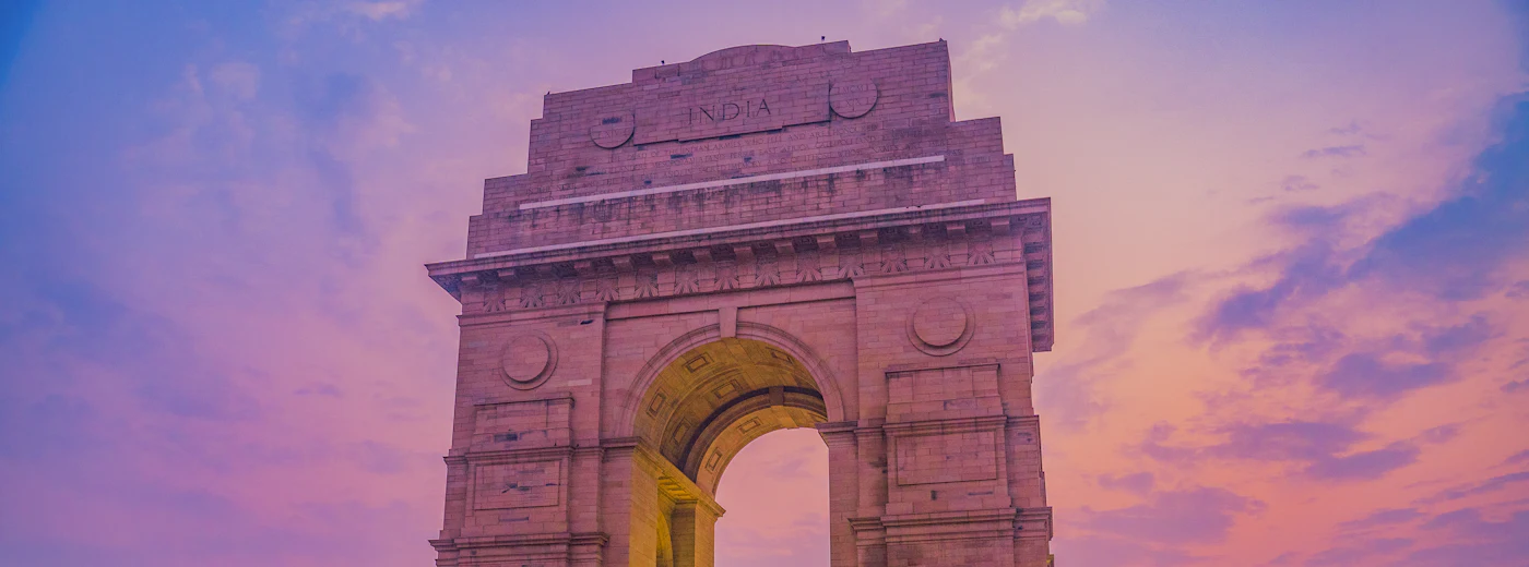 India Gate in New Delhi under an evening sky