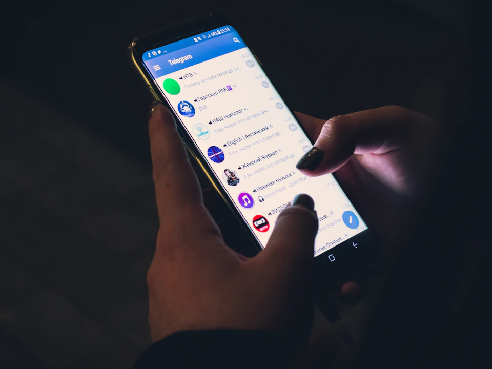 Person scrolling social media on a smartphone