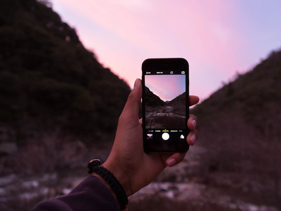 Person filming with a smartphone camera