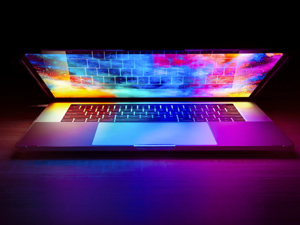 Laptop with a colourful website design on screen